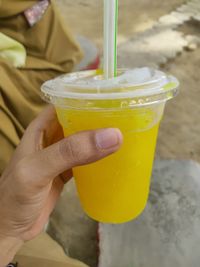 Close-up of hand holding drink