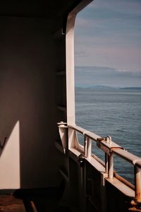 Scenic view of sea against sky taken from ferry deck with sunshine and shadows