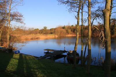 Scenic view of calm lake against clear sky