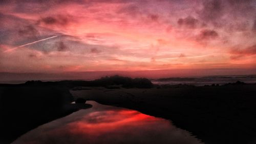 Scenic view of dramatic sky during sunset