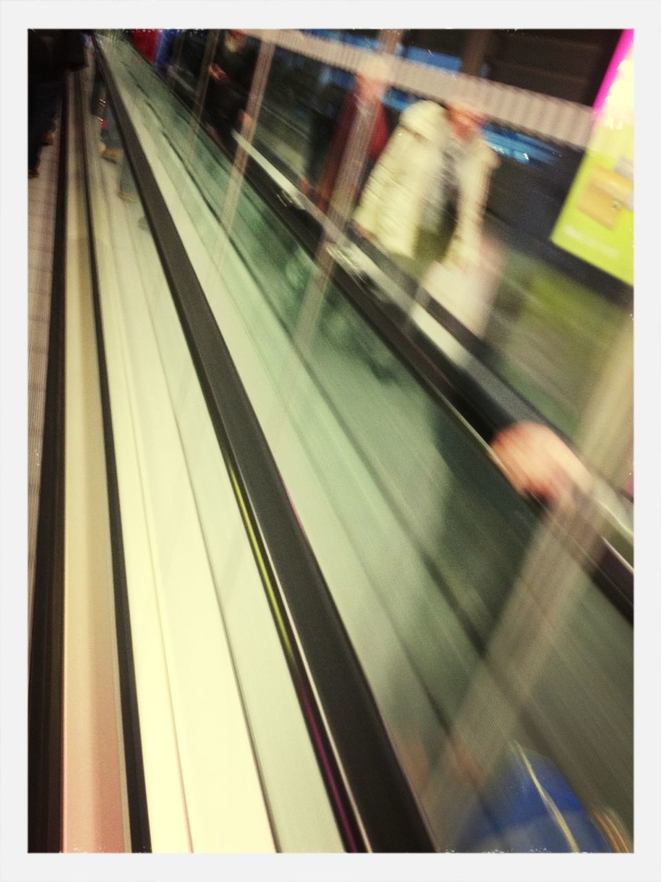 transportation, indoors, transfer print, glass - material, blurred motion, public transportation, auto post production filter, motion, transparent, mode of transport, on the move, window, speed, travel, illuminated, railroad station, railroad station platform, reflection, rail transportation, train