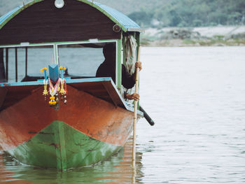 Boat moored in lake