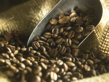 Close-up of roasted coffee beans in jute