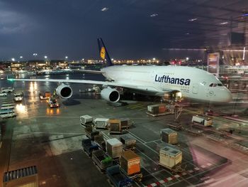 High angle view of airplane at airport runway