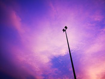 Low angle view of silhouette street light against sky