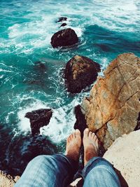 Low section of man on rock