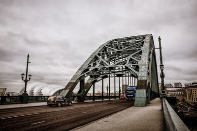 View of bridge in city against sky