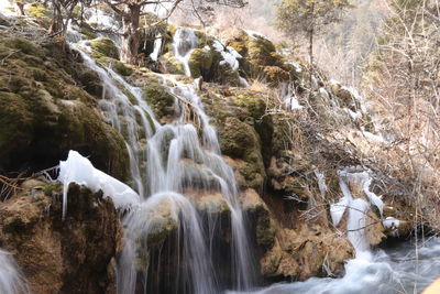 Beautiful view of waterfall in jiuzhaigou national park in china, the heaven on the earth with snow