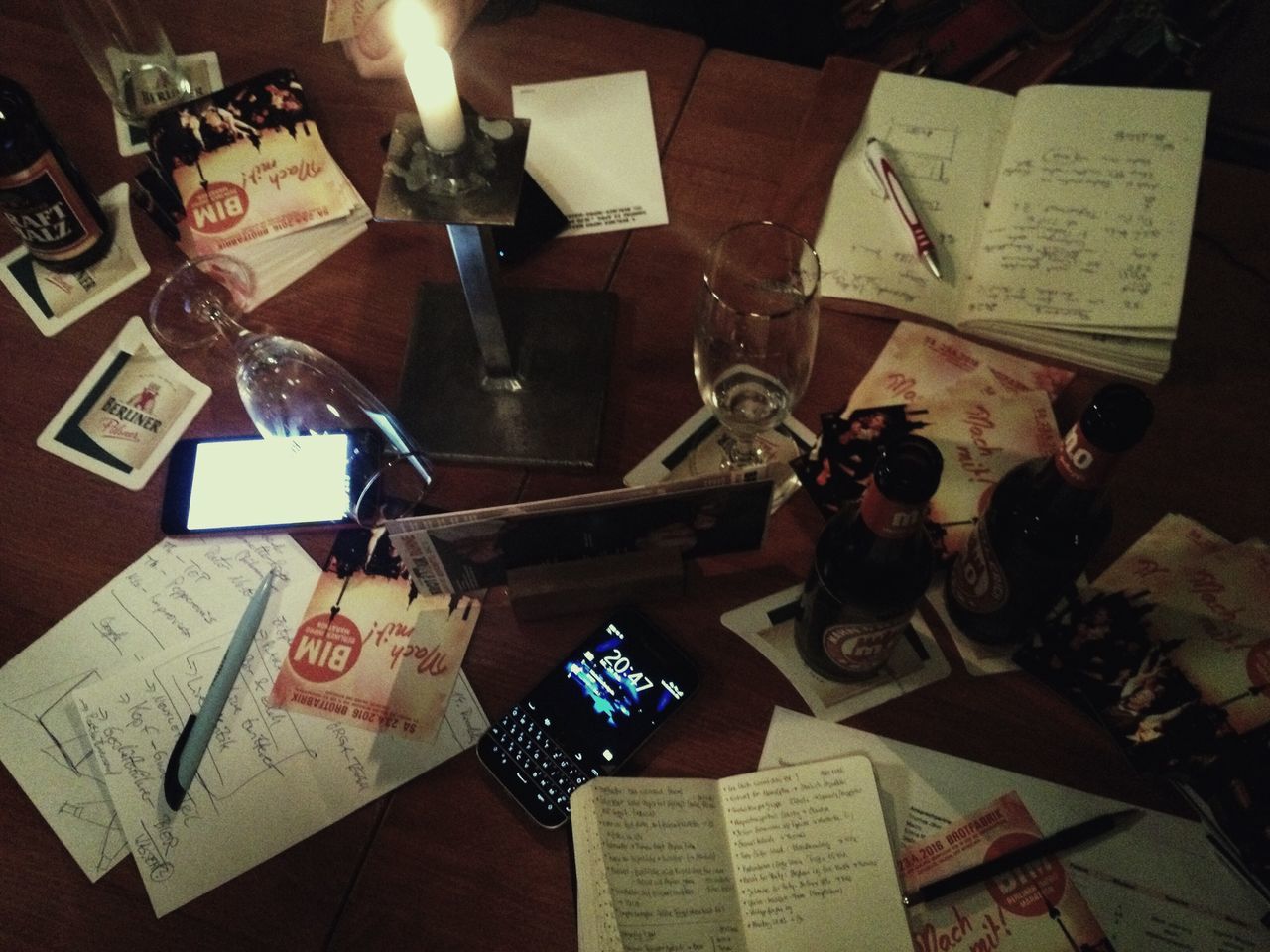 indoors, table, text, paper, communication, still life, high angle view, western script, book, art and craft, creativity, home interior, education, wood - material, art, no people, close-up, technology, variation, human representation