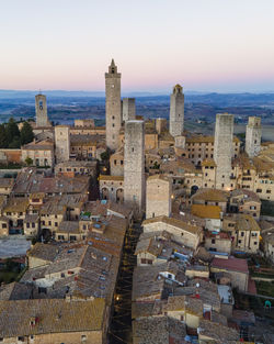 Aerial view of san gimignano, a small old town with medieval tower at sunset, siena, tuscany, italy.