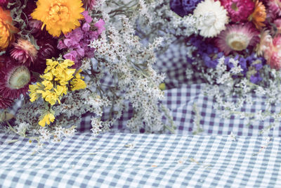 Close-up of flower bouquet on tiled floor