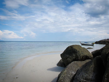 Scenic view of sea against cloudy sky