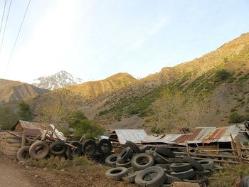 Stack of truck on mountain against sky