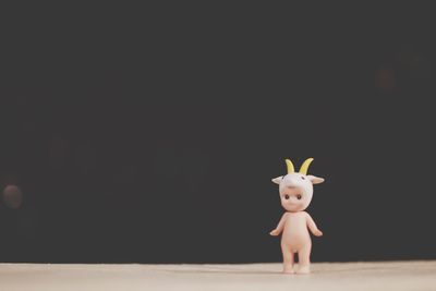 View of stuffed toy against black background