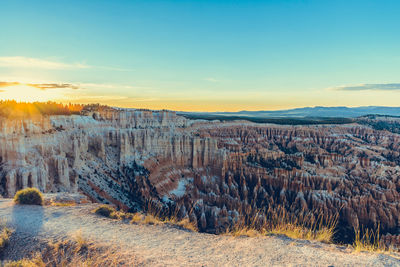 Scenic view of landscape against sky during sunset