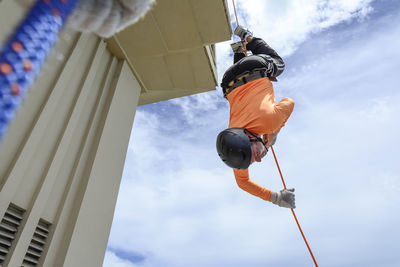 A man rappelling down the lacerda elevator. city of salvador, bahia, brazil.