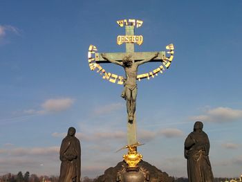 Low angle view of statue against sky