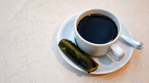High angle view of coffee cup on table