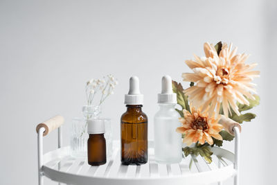 Close-up of beauty products against white background