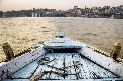 Early morning scenic view of river gange with buildings of varanasi against sky - varanasi - india