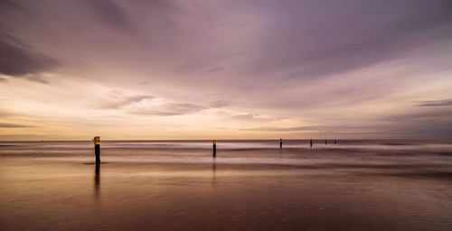 Scenic view of sea against sky at sunset
