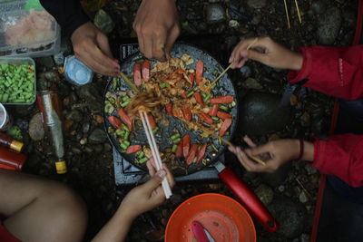 High angle view of people preparing food