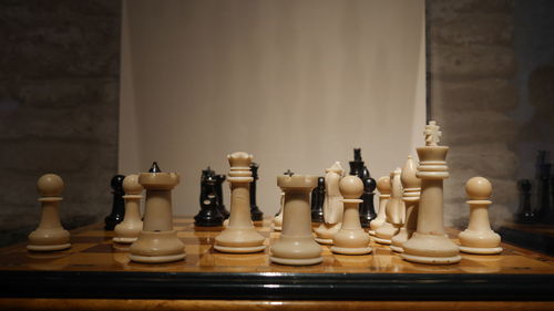 Close-up of chess pieces on table