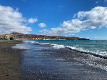 Scenic view of beach against sky