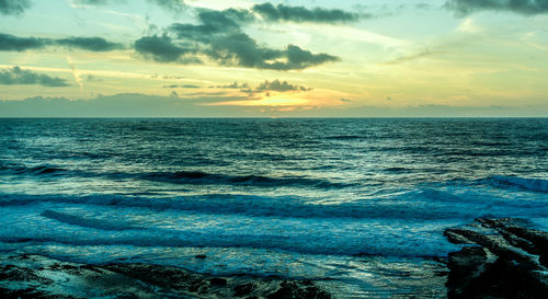 Scenic view of sea against sky during sunset