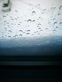 Close-up of raindrops on windshield