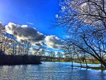 Scenic view of lake against cloudy sky