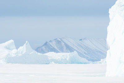 Ice bergs on frozen sea, greenland.