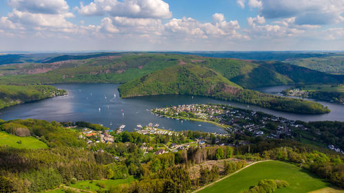 Scenic view of landscape and lake against sky