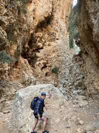 Rear view of person on rock