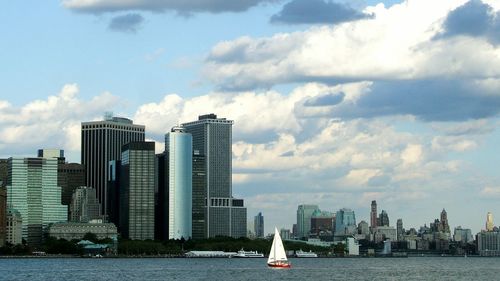 City skyline against cloudy sky