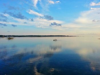 Scenic view of sea against cloudy sky