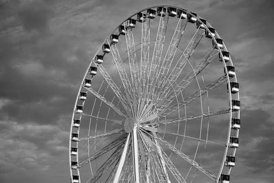 Low angle view of ferris wheel against sky