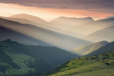 Scenic view of mountains against sky during sunset