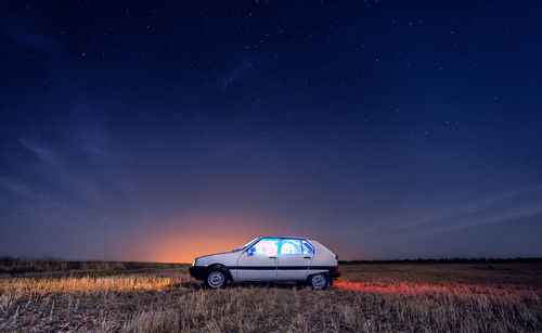 View of car on field at night