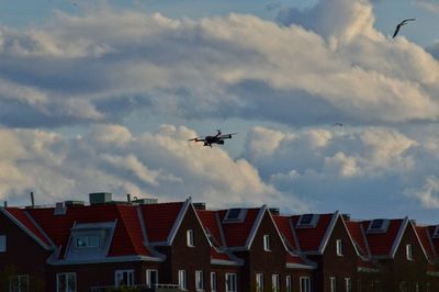 Low angle view of drone flying in sky