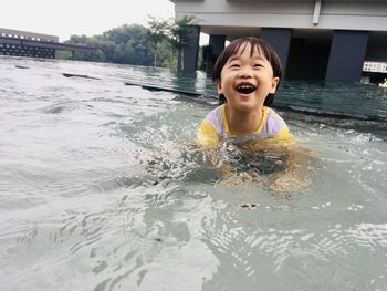Portrait of cute boy in swimming pool