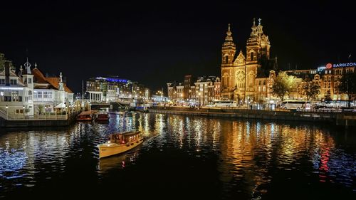 Illuminated buildings at waterfront