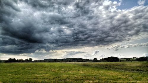 Storm clouds over field