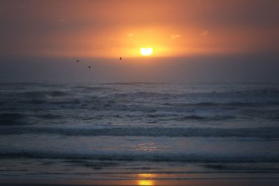 Scenic view of sea at sunset