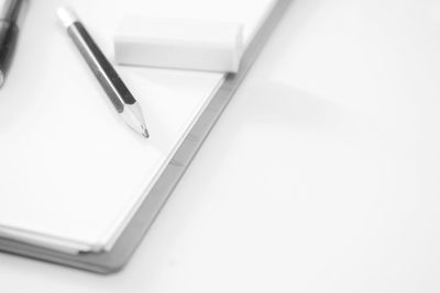 High angle view of pen on book