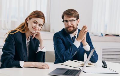 Portrait of business people sitting in office