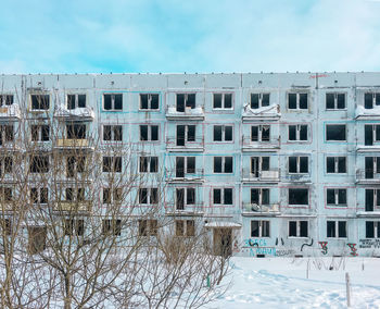 Building against sky during winter