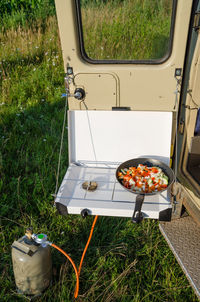 High angle view of vegetables on camping cooker