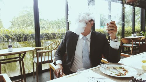 Men on table by window