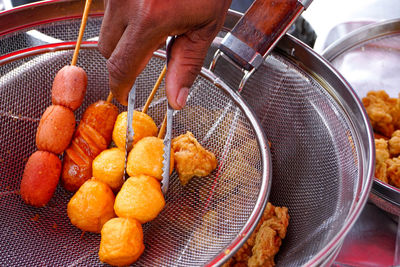 Close-up of man preparing food